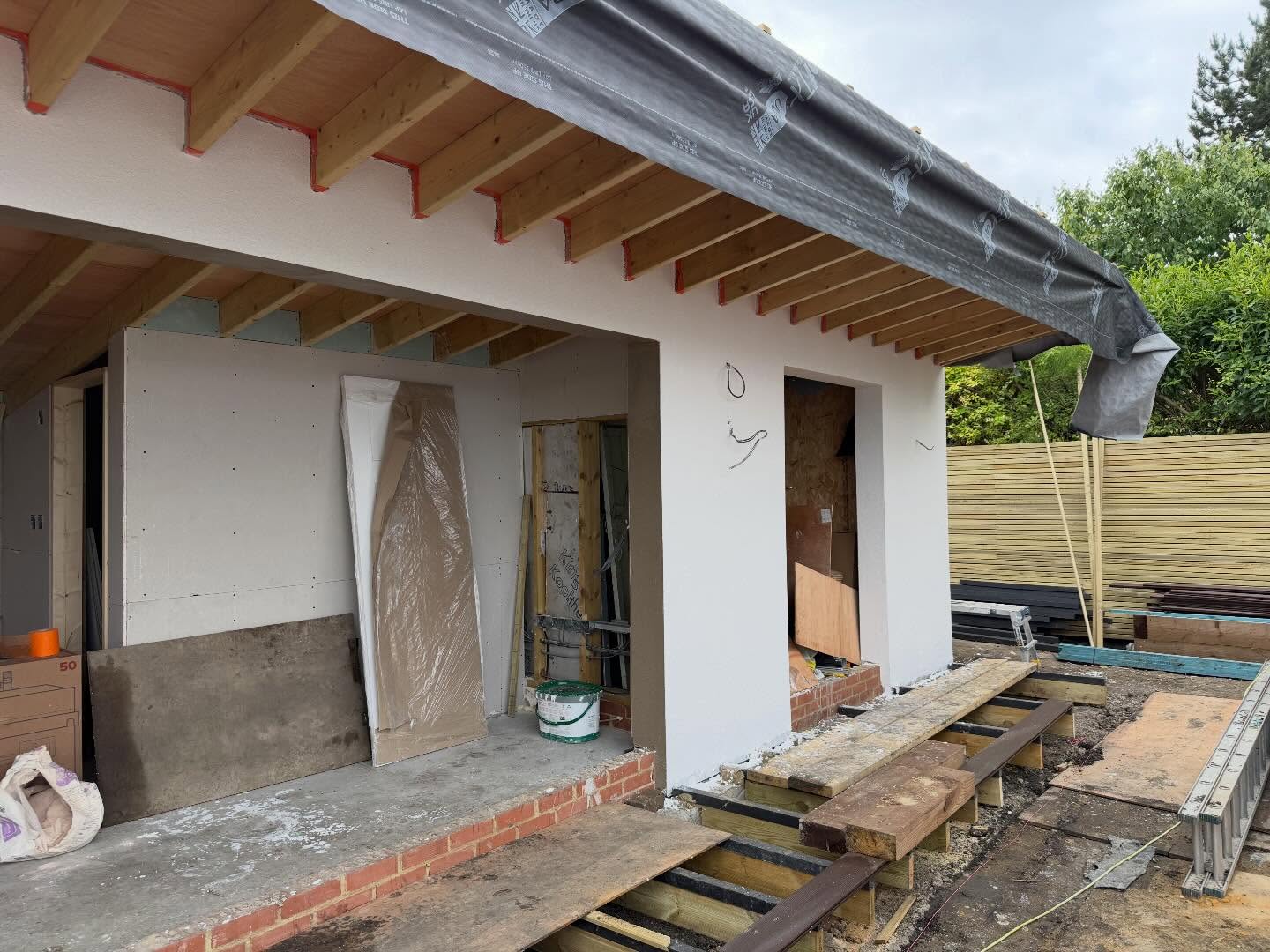 Extension being plasterboarded and rendered